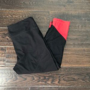 Zella cropped red and black workout pants.